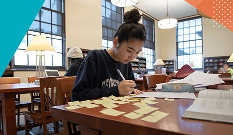 student in library