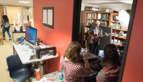 Students watch musicians performing in the Critical Making Studio