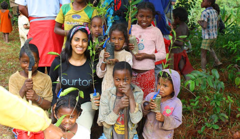 Oxy student with children in Africa