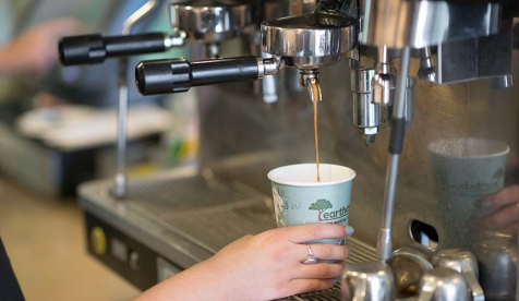 A barista pours an espresso drink at the student-run Green Bean