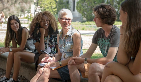 Professor Gretchen North and students talking together