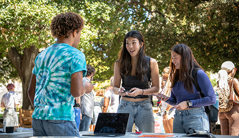 A group of Occidental (Oxy) students outdoors on campus in discussion