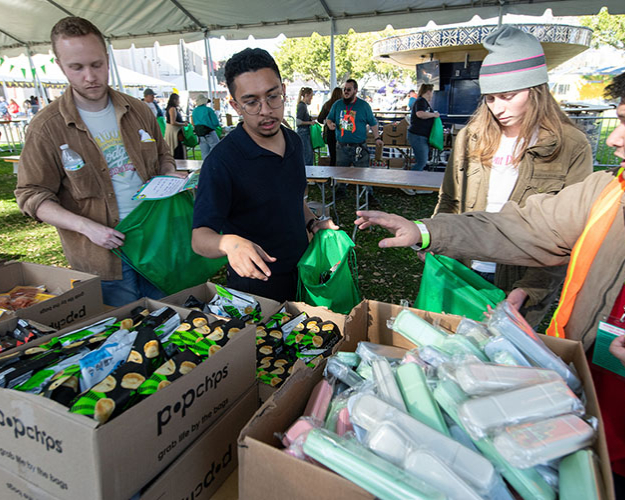 Occidental College students at a local farmer's market looking at produce