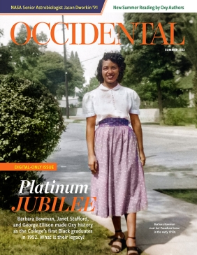 a young Black woman from the 1950s poses on campus