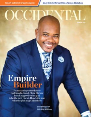 A man in a blue suit smiling brightly. Cover story: Empire B