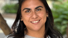 Woman in front of plants