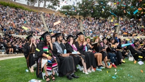 Occidental College graduates on graduation day celebrating in their seats