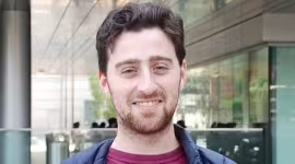 Man in front of building
