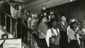 The Occidental Gospel Choir, with soloist Jacqui (Dent) Ivey '92 M'95 (foreground), performs in January 1991.