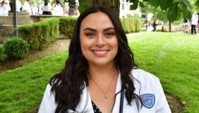 Hollie Adams in a white coat