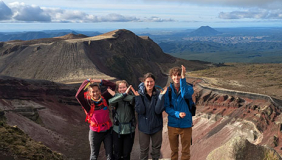 Occidental College students and faculty researching in the field on a mountain in New Zealand