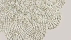 an elaborate white lace doily