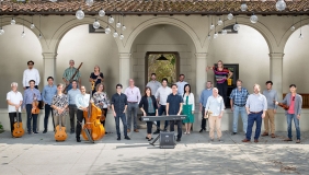 A wide-view image of the Music Dept faculty members posing as a group