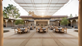 A view of Cannon Plaza set up with tables and chairs and place settings.