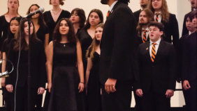 students singing in chapel