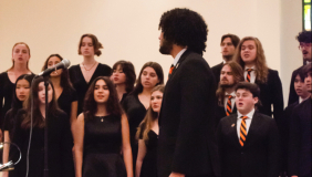 students singing in chapel