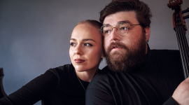 cellist Ryan Phipps and pianist Anastasia Maksiuta in black 