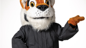 Oswald in a cap and gown