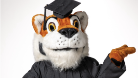 Oswald in a cap and gown