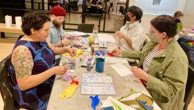 People make art together at a table