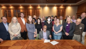 President Harry J. Elam, Jr. signs the Second Nature Climate Pledge