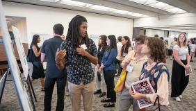 an Occidental College student presenting his undergraduate research project
