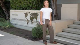 an occidental student stands outside of Johnson Hall on the Occidental LA campus