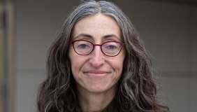 Yelena Gluzman in a black sweater and long hair