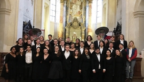 The Glee Club posing inside of a church