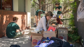 A student finding second-hand dorm goods at the fall move in sale 2024
