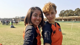Two Oxy students on the rugby team pose together