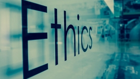 "Ethics" on a glass background