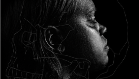 Dark photo of a woman in profile