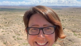 Dr. Kate Boersma in front of desert landscape