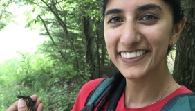 Neha Savant holding a lizard