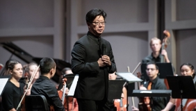 Conductor Chris Kim and the orchestra