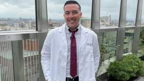 Pierce DiMauro in a white coat