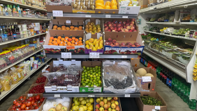 a grocery store with shelves of fresh produce