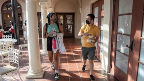 Two students with masks on campus