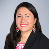 Carla Macal headshot black blazer