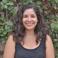 Woman in front of plants