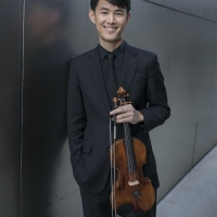 Jin-Shan Dai posing with violin