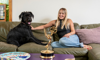 Two-time Emmy winner Emma Choate ’20 with her 2-year-old Irish wolfhound, George.