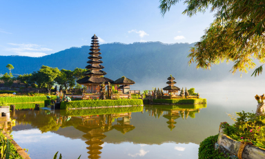 A historical building next to a river in Indonesia