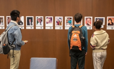 Students looking at an interactive exhibit in the Oxy library