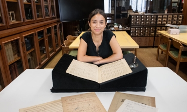 Francesca Rodoni '24 examining a musical manuscript of Franz Liszt