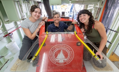 Prof. Shana Goffredi and two Oxy students pose with deep sea submersible ALVIN.