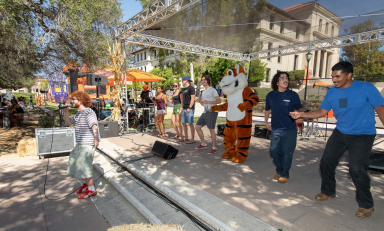 Students dancing at Oswald's Harvest Festival at Occidental's Homecoming & Family Weekend