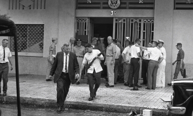 Deputy Ambassador U. Alexis Johnson ’31, left, evacuates the U.S. Embassy in Saigon on March 31, 1965.