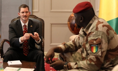Michael Gonzales '96 with Guinean Transition President Mamady Doumbouya.